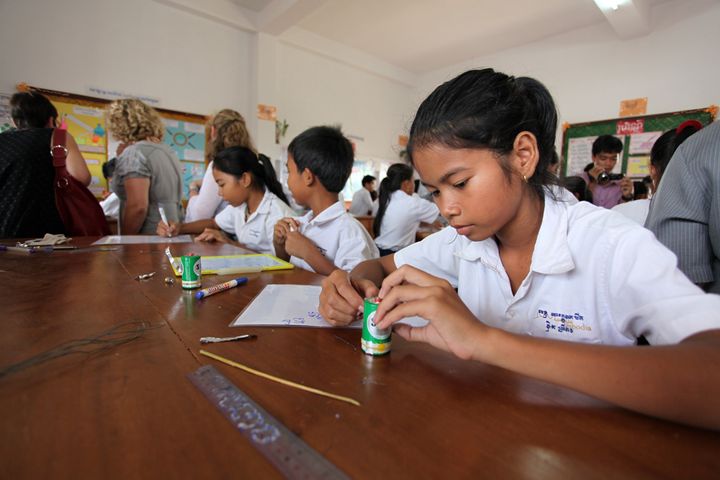 Students learn to conduct science experiments, part of the Caring for Cambodia’s STEM education program. Location: Aranh Cuthbert Lower Secondary School, Siem Reap. 