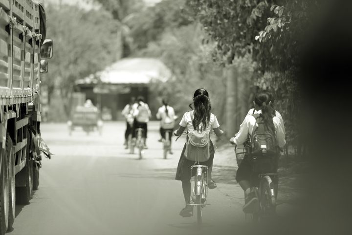 Bicycles are the main means of transportation to and from school for all Cambodian students. Location: Siem Reap. 