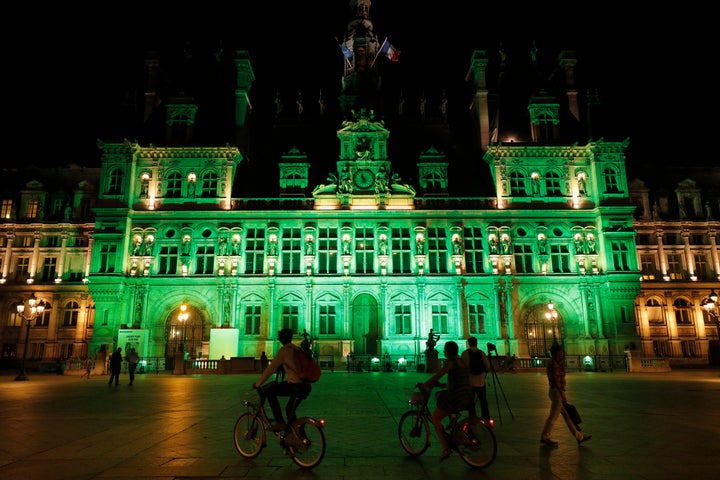Green lights are projected onto the facade of the Hotel de Ville in Paris, France, after Trump announced his decision that th