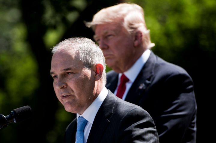 US President Donald Trump (R) listens while Environmental Protection Agency Administrator Scott Pruitt speaks after announcing the U.S. will withdraw from the Paris accord. 
