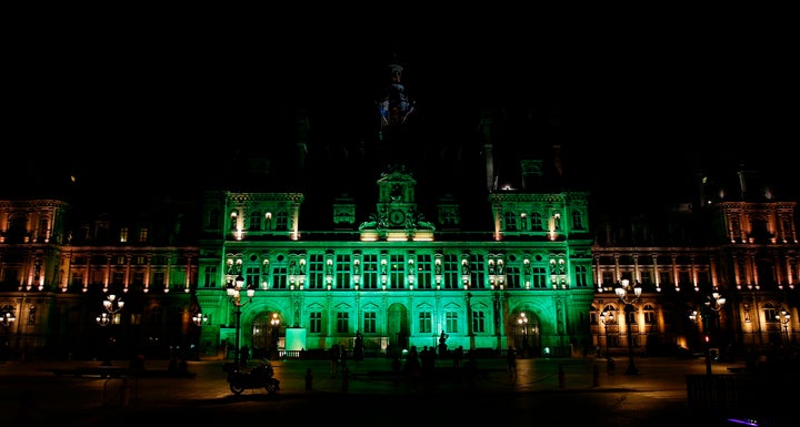 A picture taken Thursday shows the city hall of Paris illuminated in green following Trump's announcement that the United States will withdraw from the 2015 Paris accord.