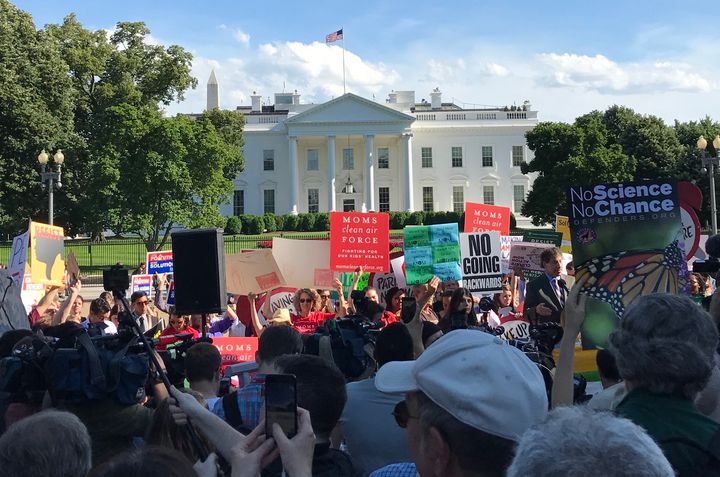 Protesters filled LaFayette Park to protest President Donald Trump's decision to pull out of the Paris Climate Accord.