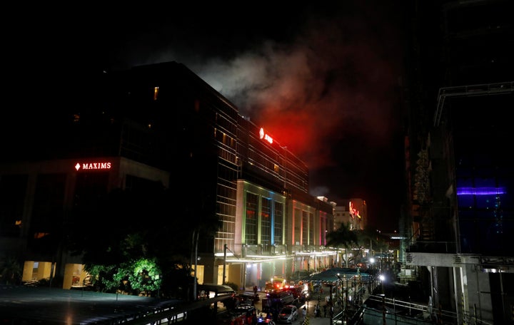 Smoke billows from the Resorts World building in Manila on Friday.