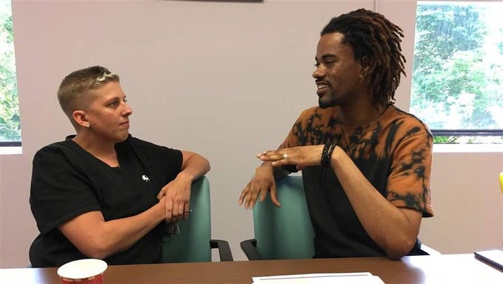 Jamie Longo (left) and Tarik Arafat, “recovery coaches” at Community Health Action of Staten Island in New York, discuss care