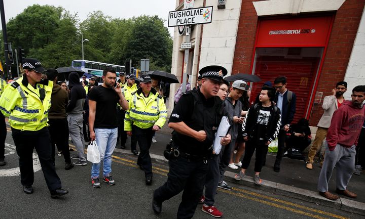 Police evacuate people in Rusholme Place in Manchester after finding a car that may be linked to the Manchester Arena bombing