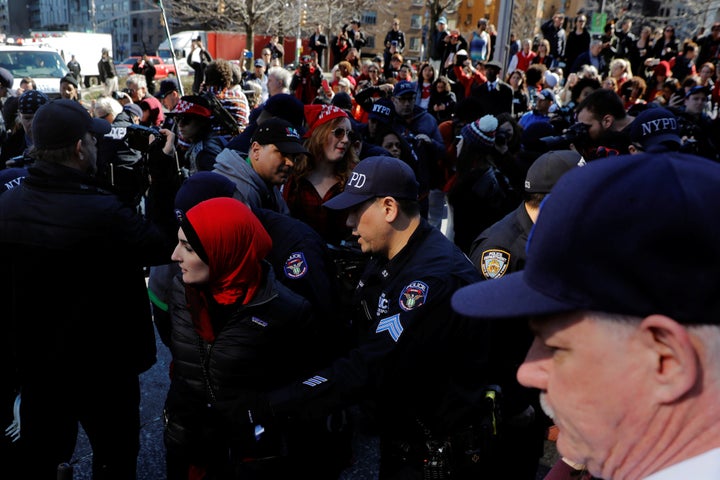 New York Police Department officers arrest an organizer Linda Sarsour who was taking part in a 'Day Without a Woman' march on International Women's Day in New York, U.S., March 8, 2017.