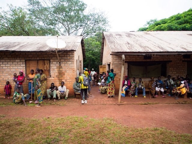 People wait in front of Uganda People’s Defence Force (UPDF) hospital on June 25, 2014, in Obo. Now women are worried what will happen when the UPDF leaves.