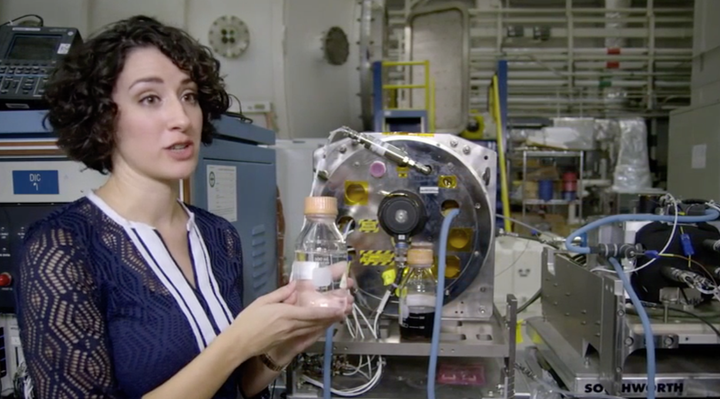 NASA engineer Jennifer Pruett shows off a distillery that can turn urine into drinking water.