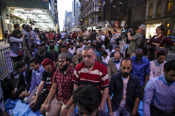 Demonstrators pray during an iftar outside of Trump Tower in New York City on Thursday, June 1, 2017.