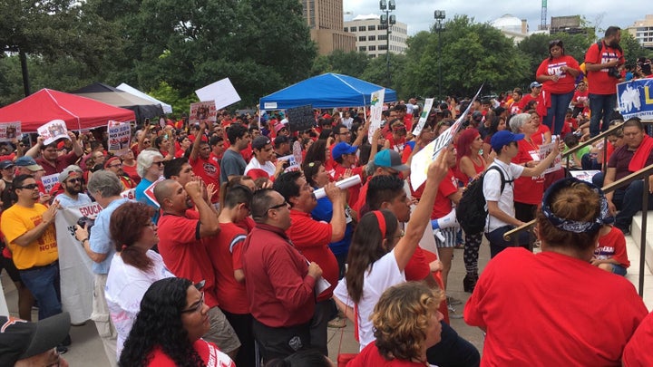 Immigrants with the Fair Immigration Reform Movement protest Gov. Greg Abbott’s Show Me Your Papers law in Texas’s state capi