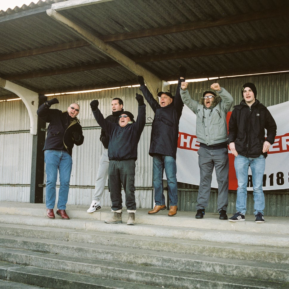 Mick (L), John (3R) and friends celebrate Tilbury scoring against Haringey on Jan 14.