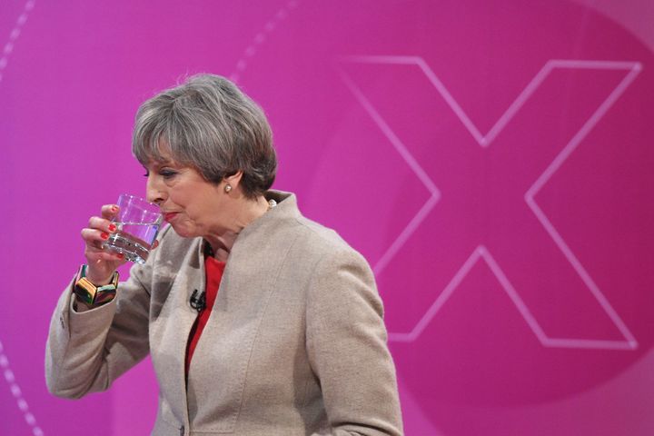 Prime Minister Theresa May sips some water as she takes part in the BBC's Question Time on Friday