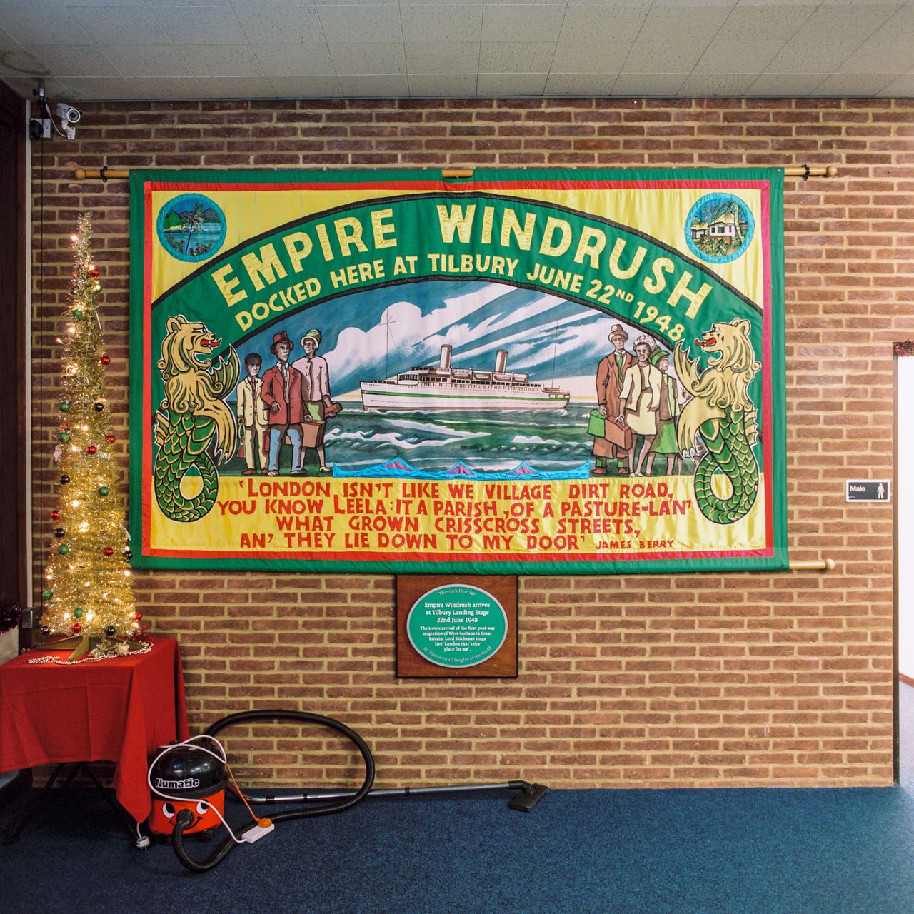 A banner commemorating the Empire Windrush on the wall of Tilbury Cruise Terminal on Dec. 19, 2016.