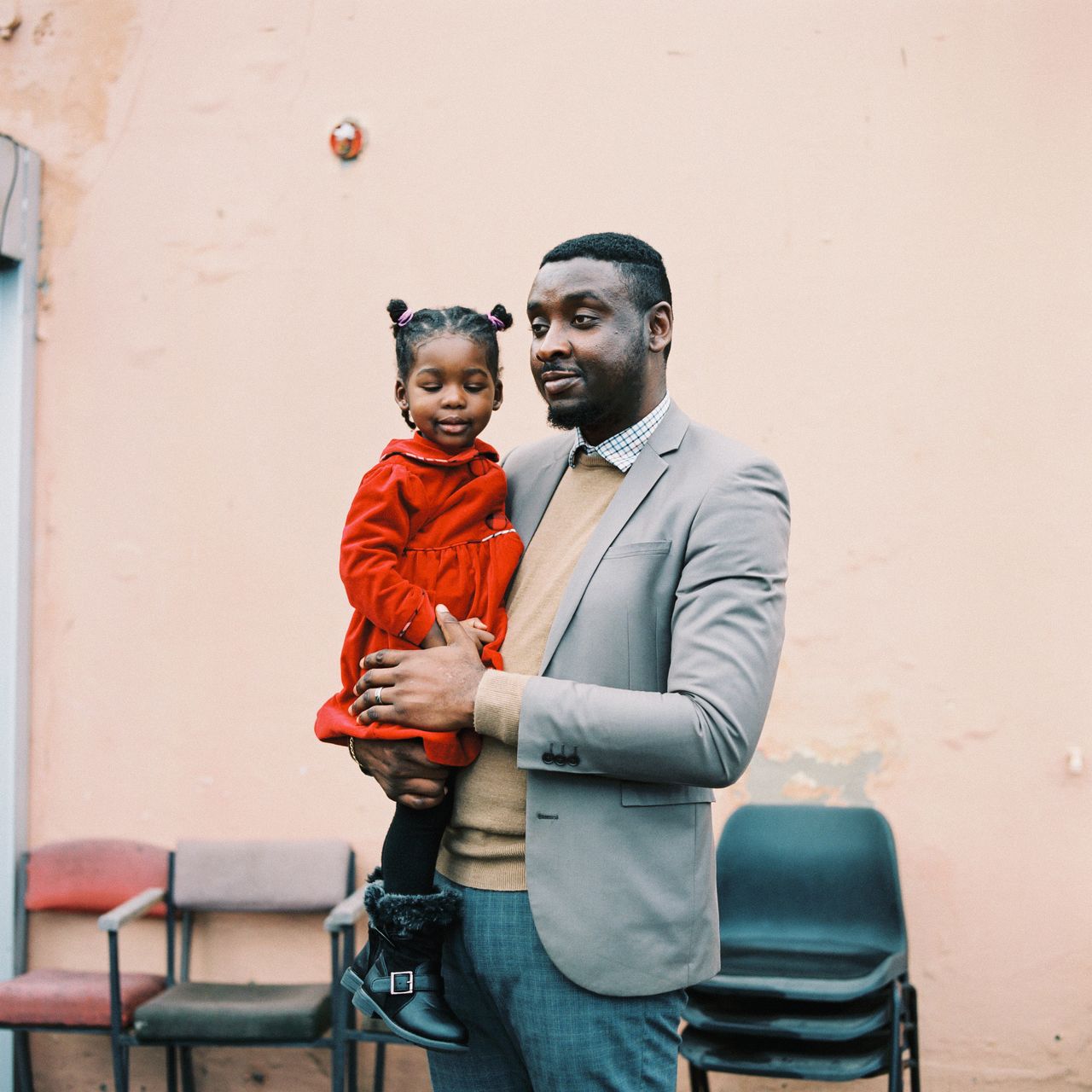 Ayo Ariyibi, a member of the Fruitful Land congregation, with his daughter Rebekah after Sunday service on Jan. 29.