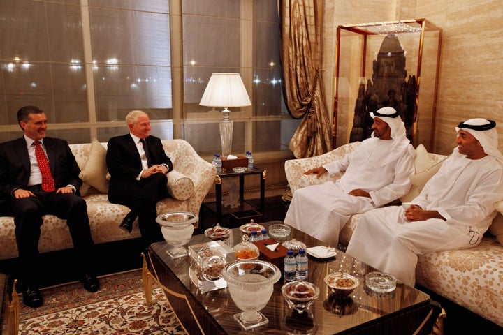 Former Defense Secretary Bob Gates, second left, was in frequent contact with Otaiba, far right. He spoke on May 23 at a Foundation for Defense of Democracies conference on Qatar.