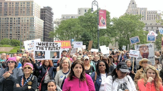 Hundreds of demonstrators in New York City took to the streets Saturday to protest President Donald Trump's ties with Ru