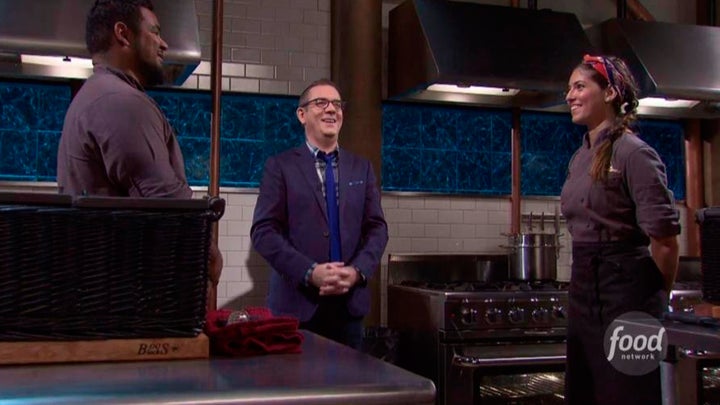 <p>Facing her opponent in the final round of an episode of <em>Chopped</em>.</p>