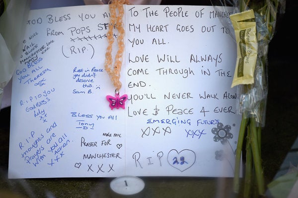 Messages are left amongst tributes by members of the public in St. Ann's Square on Tuesday May 23, 2017 in Manchester.