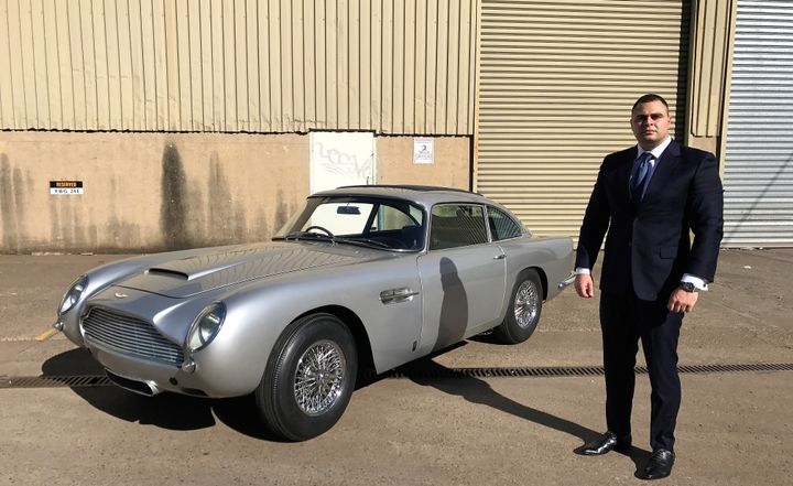 Lecha Khouri (Agent James Bond 007) beside the 1963 Aston Martin DB5. 