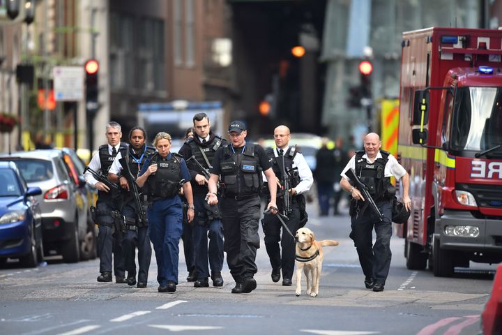 Armed police on St Thomas Street, London, near the scene of Saturday night's attack