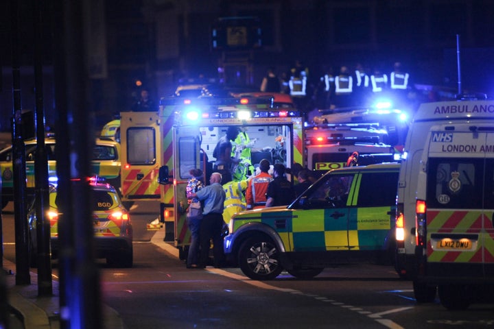 Members of the emergency services attend to victims of a terror attack which began on London Bridge.