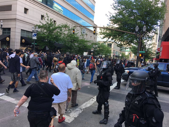 Anti-fascist protestors and others storm the streets north of City Hall.