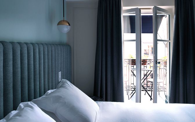 Blue, Green and grey tones create a stylish interiors with a focus on that gorgeous Parisian view