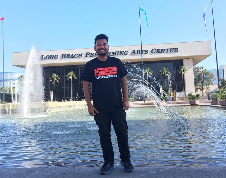 Sevly stands in front the Long Beach Performing Arts Center.