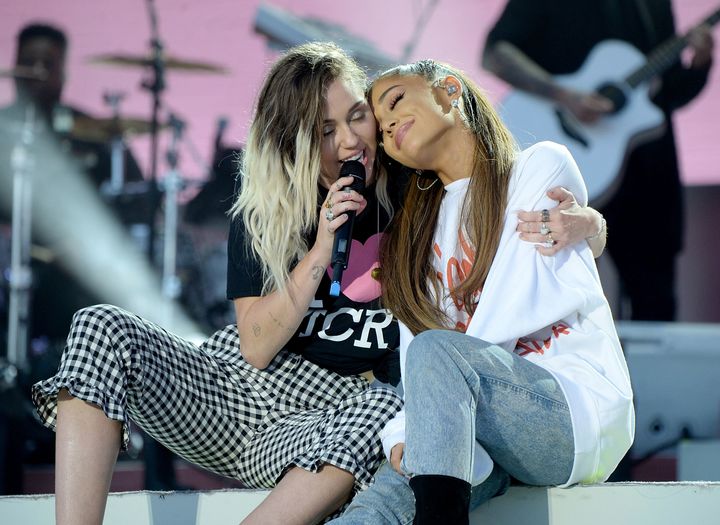 Ariana Grande on stage with her friend Miley Cyrus at One Love Manchester