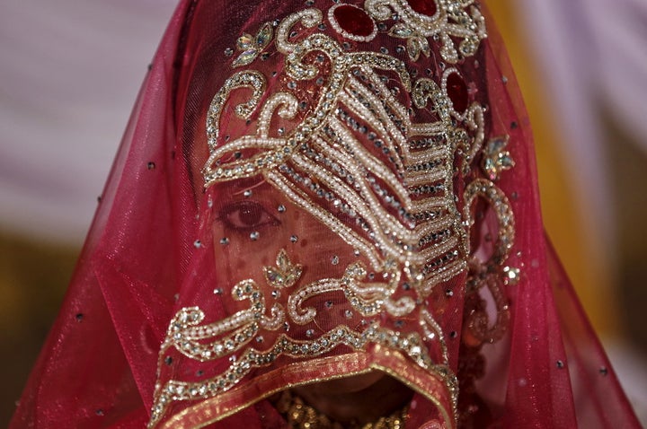 A Muslim bride waits to take vows that could be instantly broken via SMS. 