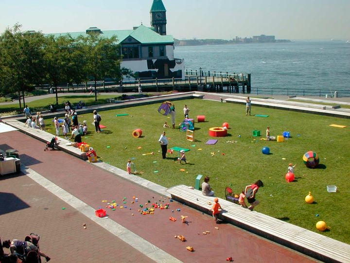 The lawn at Robert F. Wagner, Jr. Park depicted in one of its many manifestations - here a playground.