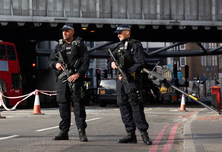Armed police guard an area close to Borough Market in London following Saturday's terrorist attack