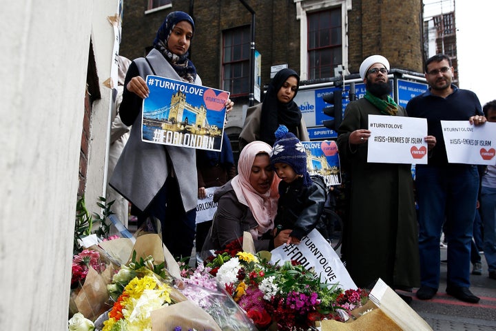 Muslims pray at a floral tribute near London Bridge, after attackers rammed a hired van into pedestrians on London Bridge and stabbed others nearby killing and injuring people, in London, Britain June 4, 2017.