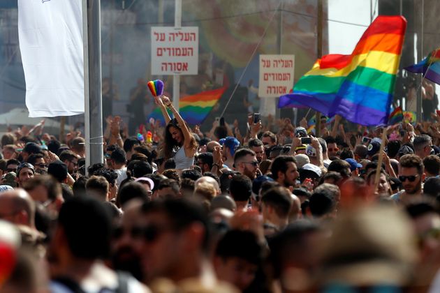 Revellers take part in a gay pride parade in Tel Aviv, Israel, June 3, 2016.