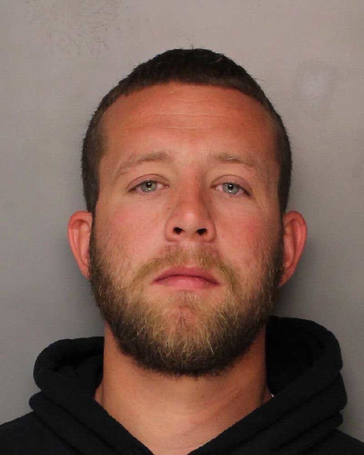 Barry Baker, 29, was arrested on Monday after video appears to show him sucker punching a disabled man.