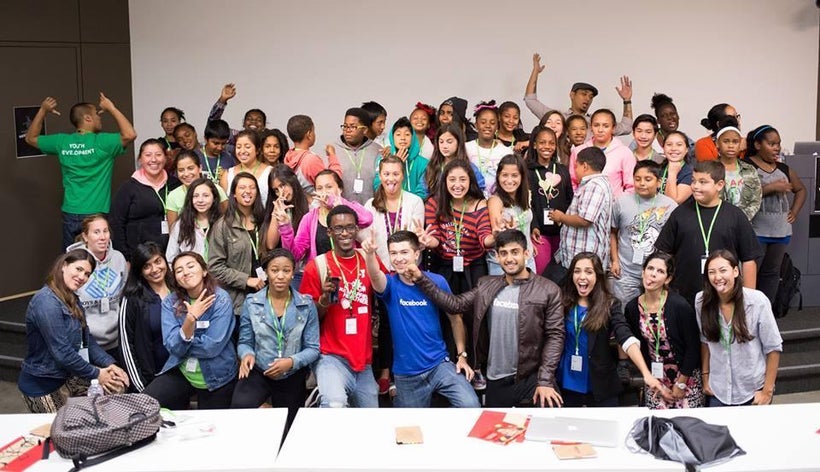 Leading an HIPGive Coding Bootcamp for YMCA children at the Facebook headquarters. Andrea Perez, 26, is featured third from t