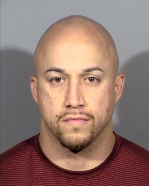 Officer Kenneth Lopera was charged on the same day the Clark County Coroner's Office ruled the May 14 death of Tashii Farmer, 40, was a homicide due to police restraint.