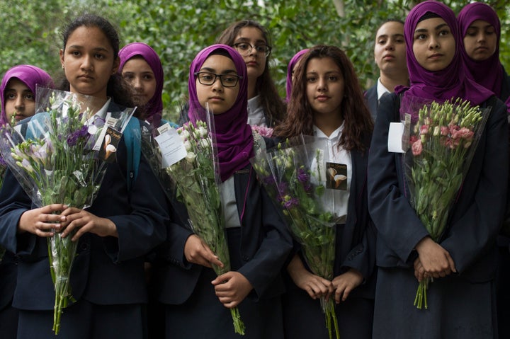 Pupils from Eden Girls' School in Waltham Forest take part in a vigil for the victims of the London Bridge terror attacks, in Potters Fields Park on June 5, 2017 in London, England. Seven people were killed and at least 48 injured in terror attacks on London Bridge and Borough Market on June 3rd. Three attackers were shot dead by armed police. (Photo by