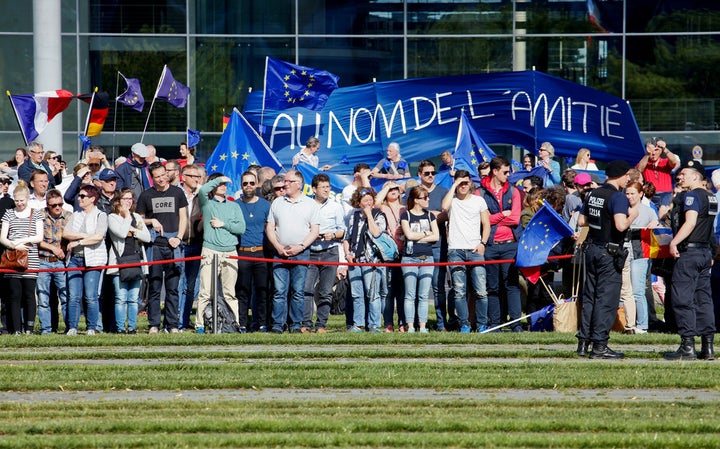 ‘Pulse of Europe’ supporters hold banners before a meeting between Angela Merkel and Emmanuel Macron on May 15 2017 in Berli