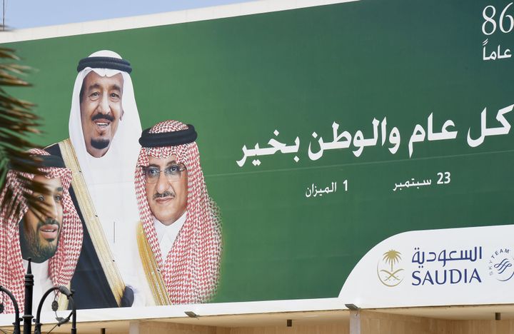 A poster of Saudi King Salman (C), Crown Prince and Interior Minister Mohammed bin Nayef (R) and Deputy Crown Prince and Defence Minister Mohammed bin Salman.