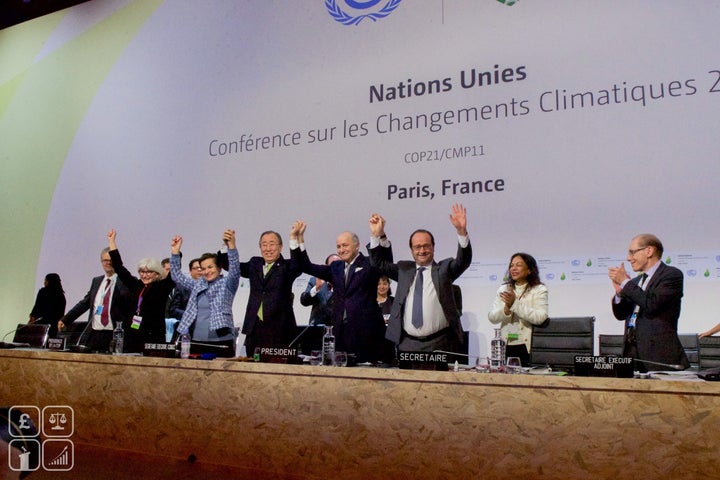 <p>Global leaders embrace at the end of the Paris Summit, 2015</p>