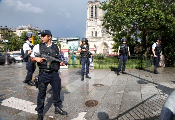 French police stand at the scene of a shooting incident near the Notre Dame Cathedral in Paris, France, June 6, 2017.