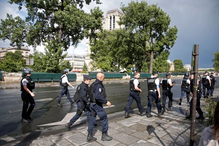 French police stand at the scene of a shooting incident near the Notre Dame Cathedral in Paris, France, June 6, 2017
