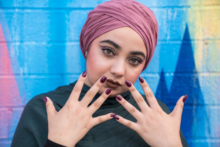 A model shows off ORLY's #HalalPaint nail polish.