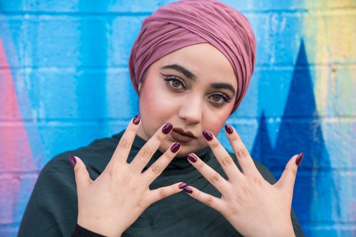 A model shows off ORLY's #HalalPaint nail polish.