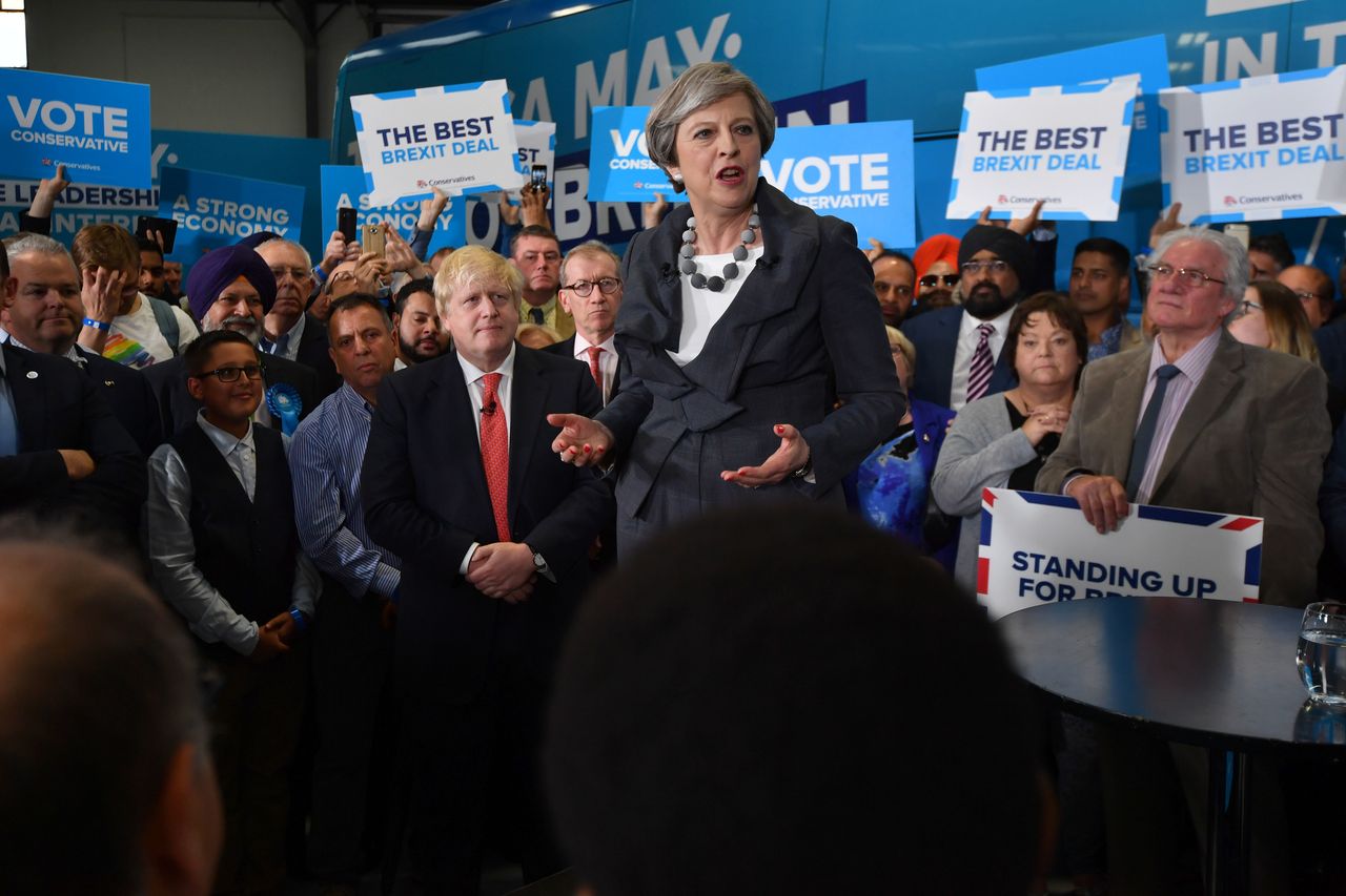 Theresa May is accompanied by Boris Johnson as she addresses supporters at a campaign event on June 6, 2017 in Slough, England