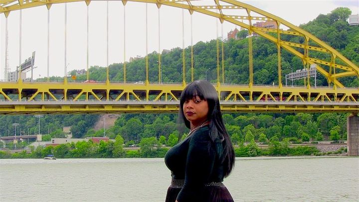 Ciora Thomas stands along the riverbank where she occasionally slept as a homeless trans youth. This year, she incorporated her organization SisTers PGHserving homeless trans women. She is also leading the Peoples Pride March 2K17. 