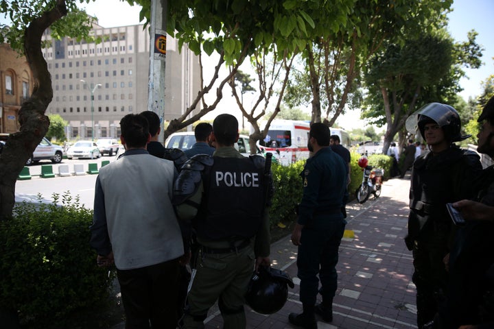 A guard was killed on Wednesday when armed men launched an attack on the parliament in central Tehran.