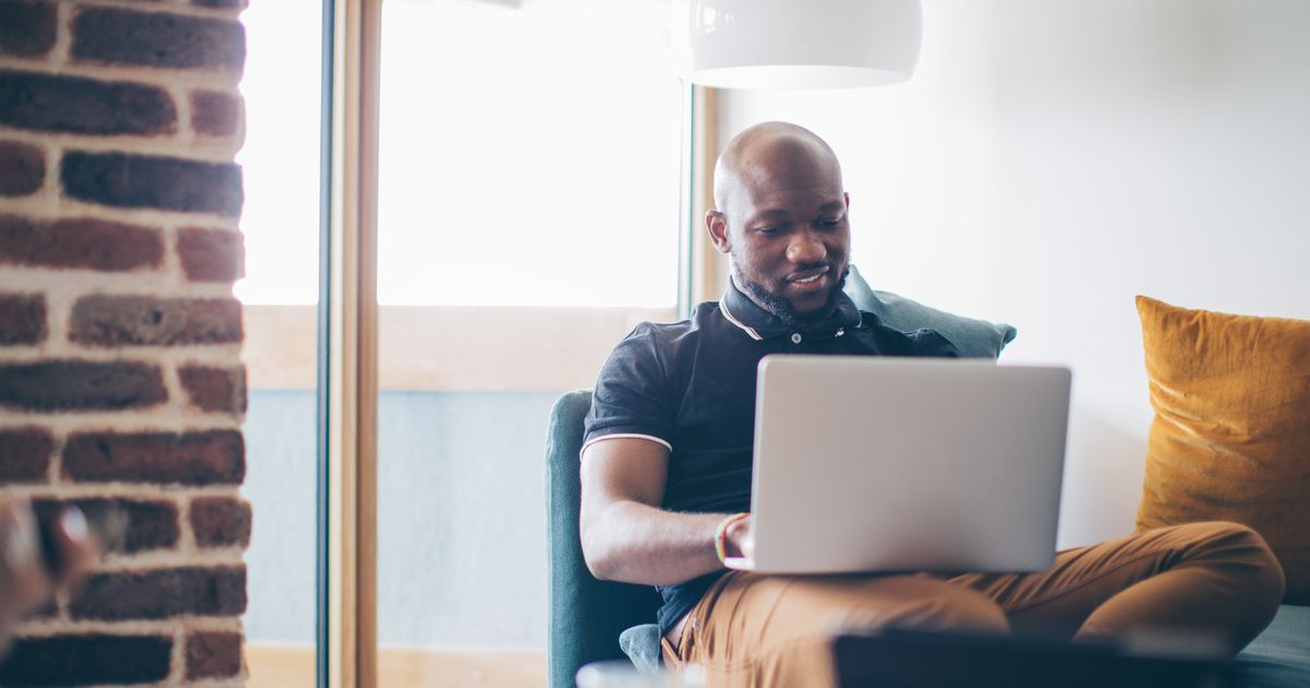 Man at work перевод. Man working from Home. Man working on Laptop at Home. Black man at the Laptop. Man work with Laptop.