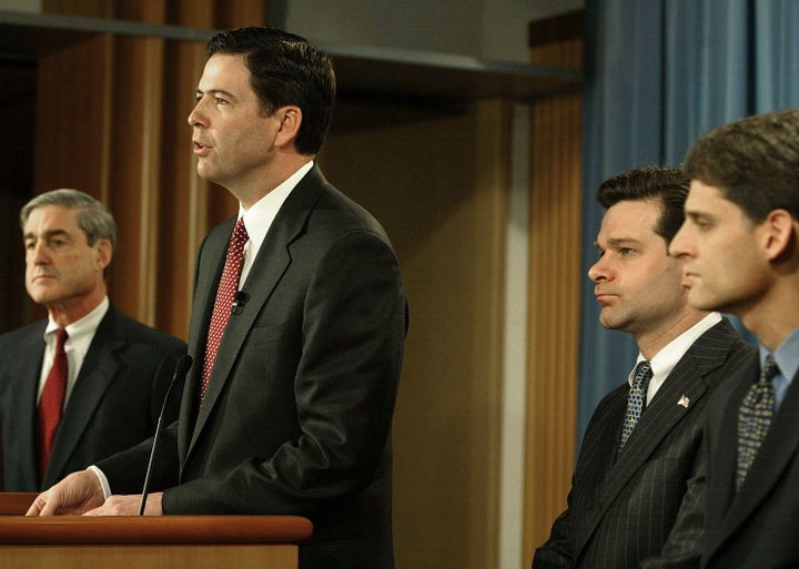 In this 2004 file photo, then-FBI Director Robert Mueller, then-Deputy Attorney General James B. Comey and then-Ass